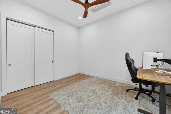 a workspace with furniture and a window