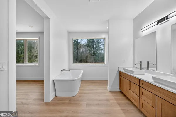 a room with wooden floor and a sink