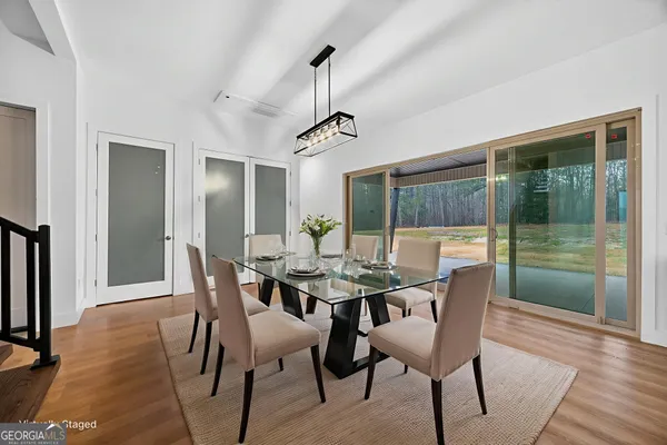 a view of a dining room with furniture window and wooden floor