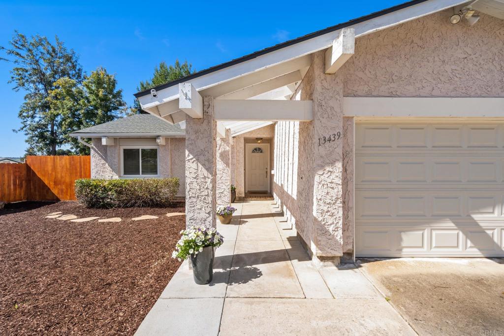13439 Orange Blossom Lane Poway, CA 92064 - Photo 22 of 36 a front view of a house with garden