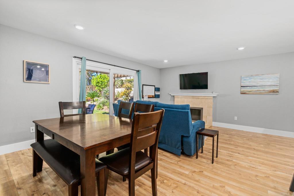 13439 Orange Blossom Lane Poway, CA 92064 - Photo 7 of 36 a view of a dining room with furniture window and wooden floor