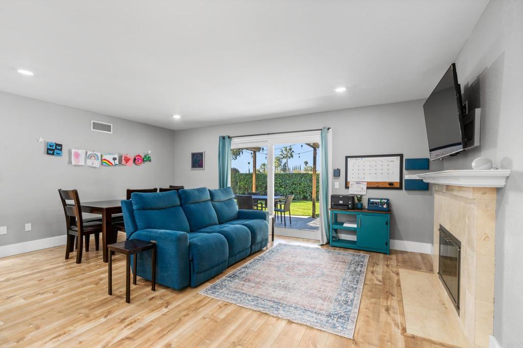 13439 Orange Blossom Lane Poway, CA 92064 - Photo 8 of 36 a living room with furniture and a flat screen tv