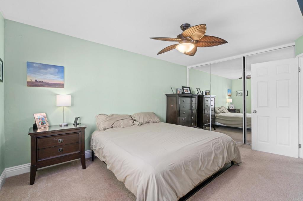 13439 Orange Blossom Lane Poway, CA 92064 - Photo 10 of 36 a bedroom with a bed and a chandelier