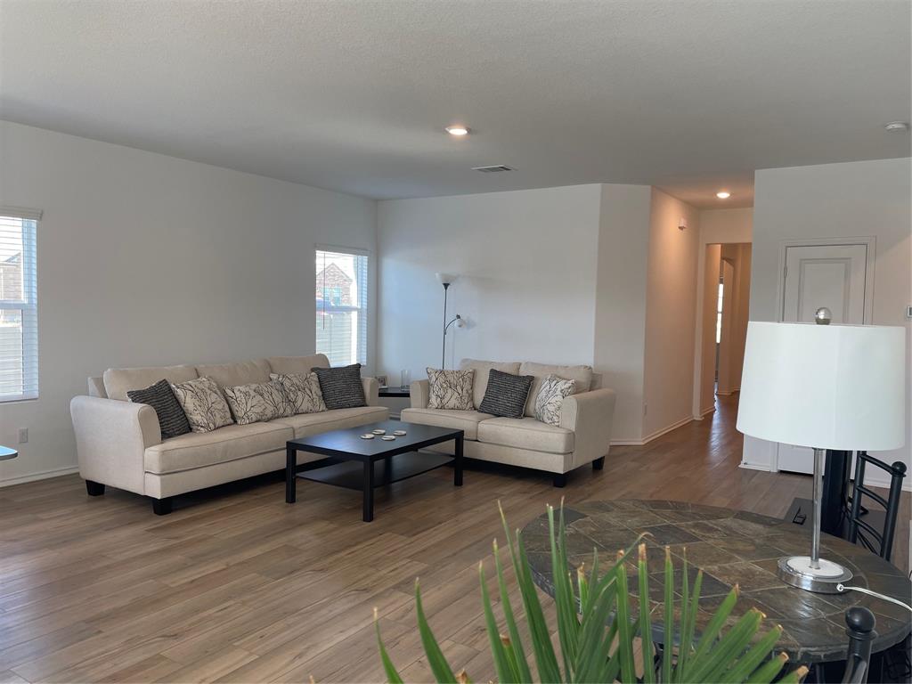 129 Starflower Cove Georgetown, TX 78628 - Photo 6 of 31 Living room featuring wood finished floors and recessed lighting