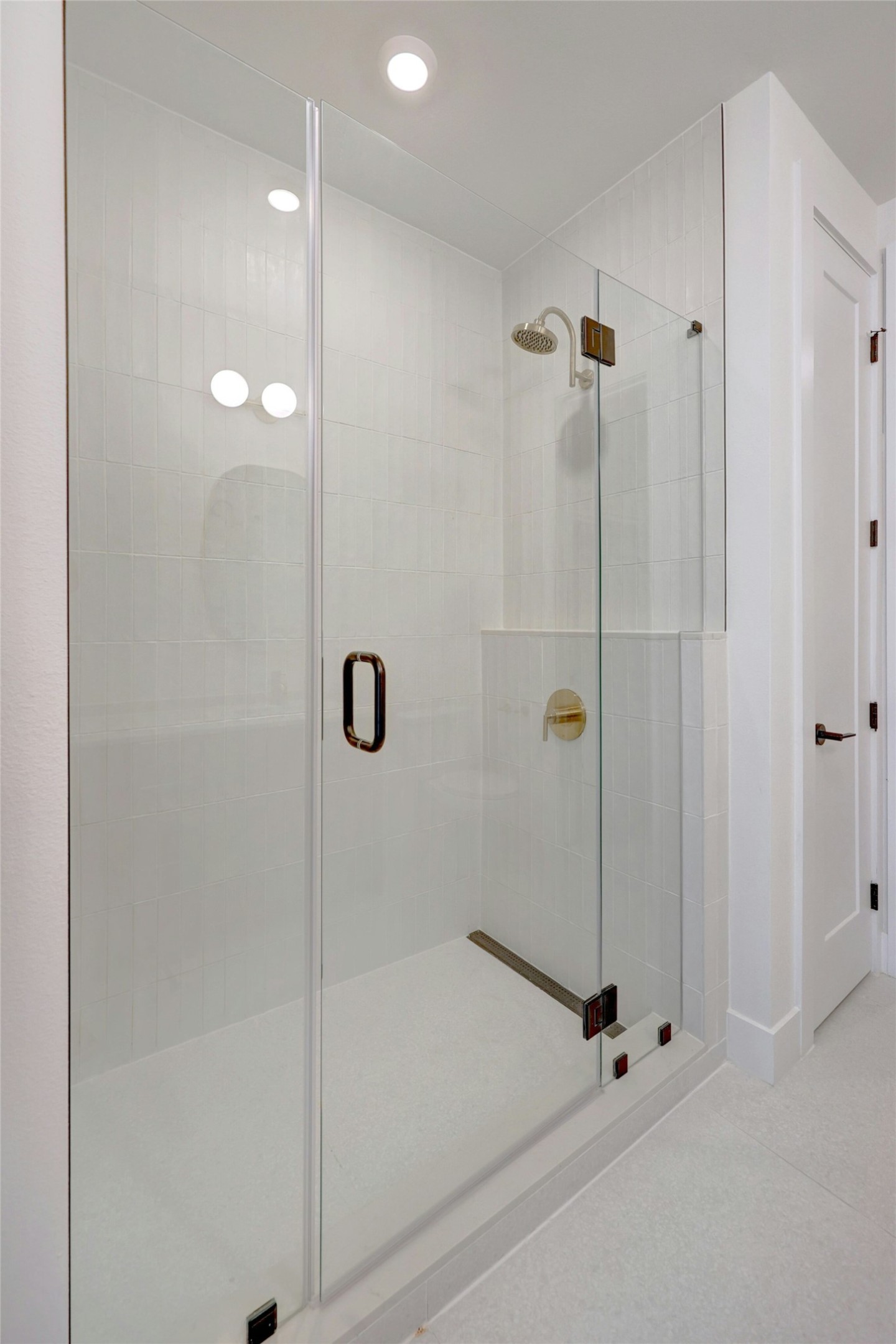 1701 Simond Avenue, Unit 411 Austin, TX 78723 - Photo 14 of 34 Bathroom with a stall shower and recessed lighting