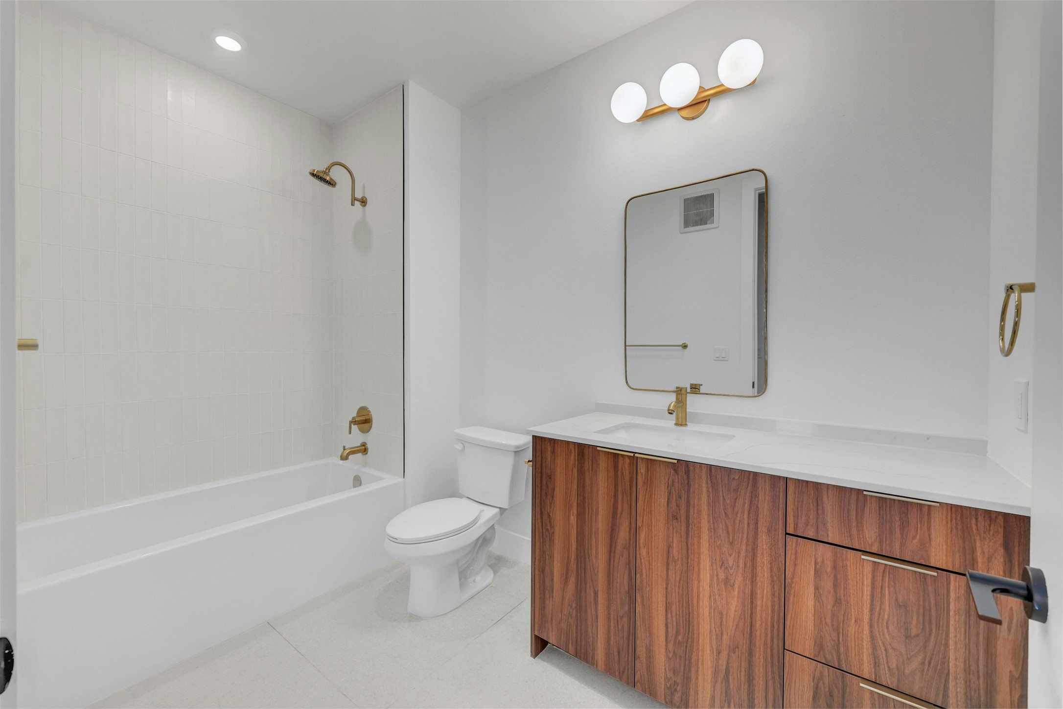 1701 Simond Avenue, Unit 411 Austin, TX 78723 - Photo 18 of 34 Full bathroom featuring vanity, shower / bath combination, and tile patterned flooring