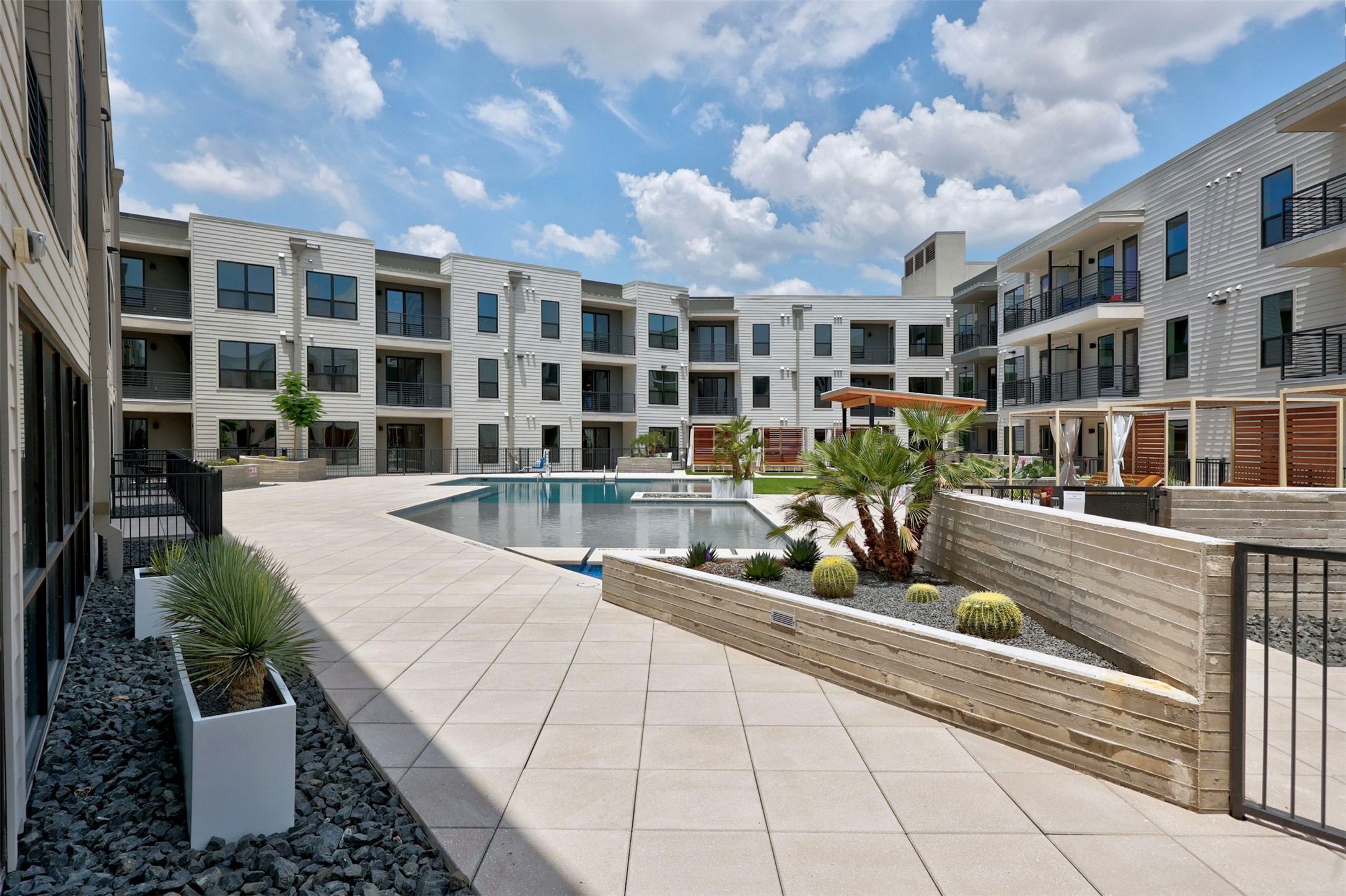 1701 Simond Avenue, Unit 411 Austin, TX 78723 - Photo 28 of 34 Community pool with a patio