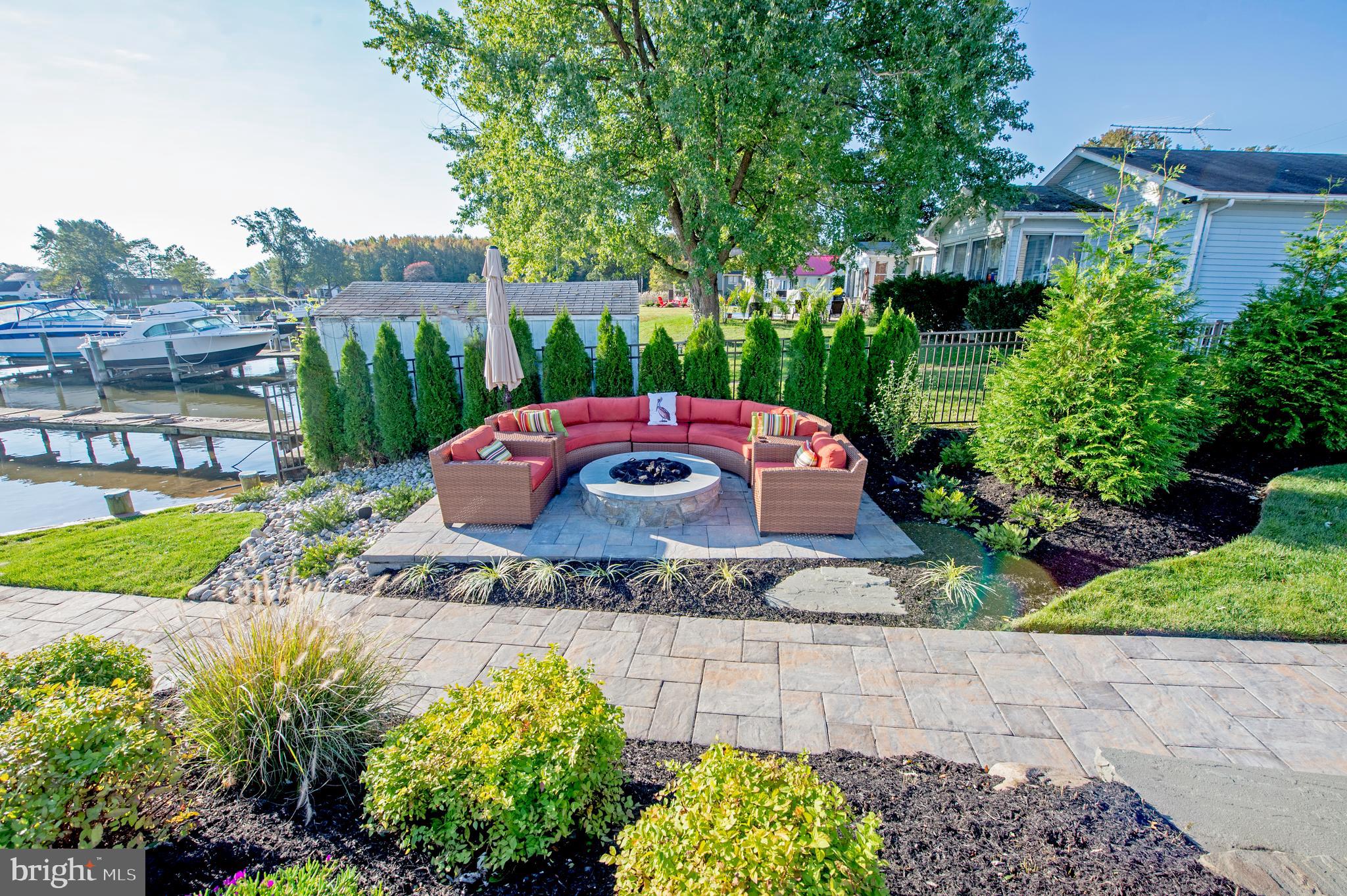 8113 Ventnor Road Pasadena, MD 21122 - Photo 35 of 45 Custom outdoor kitchen, hot tub and fire pit area