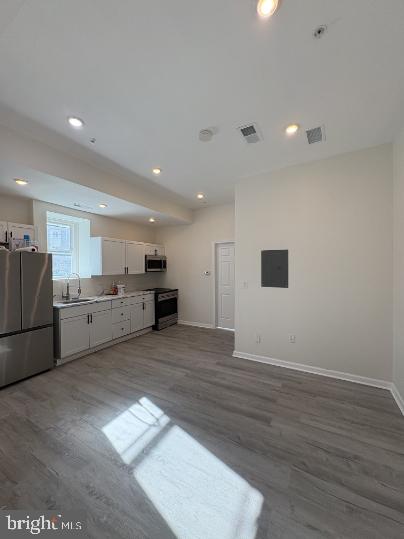 3625 North 22nd Street, Unit 1 Philadelphia, PA 19140 - Photo 2 of 9 a view of a kitchen with a sink and a refrigerator