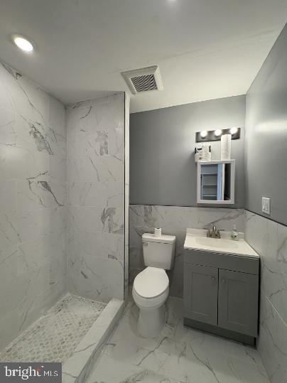 3625 North 22nd Street, Unit 1 Philadelphia, PA 19140 - Photo 4 of 9 a bathroom with a toilet sink and mirror