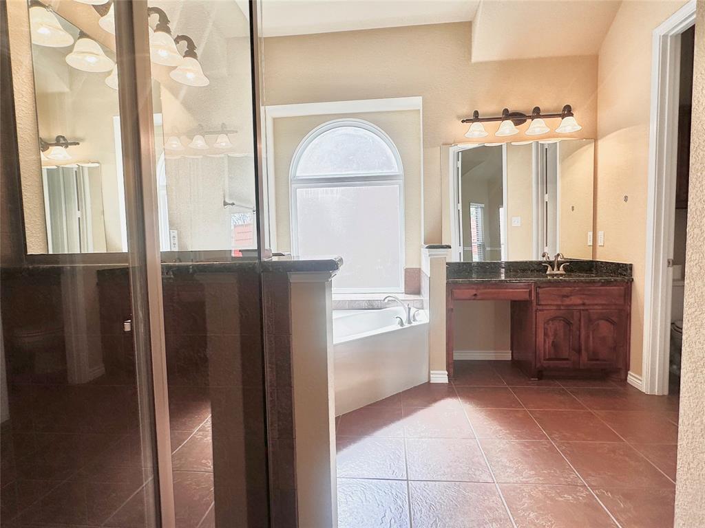 12135 Jasmine Lane Frisco, TX 75035 - Photo 15 of 31 a view of a kitchen with granite countertop a refrigerator and a stove