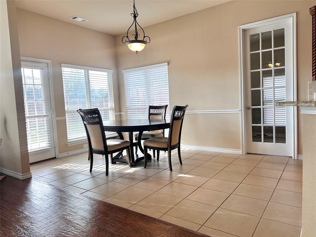 12135 Jasmine Lane Frisco, TX 75035 - Photo 6 of 31 a view of a dining room with furniture and a window
