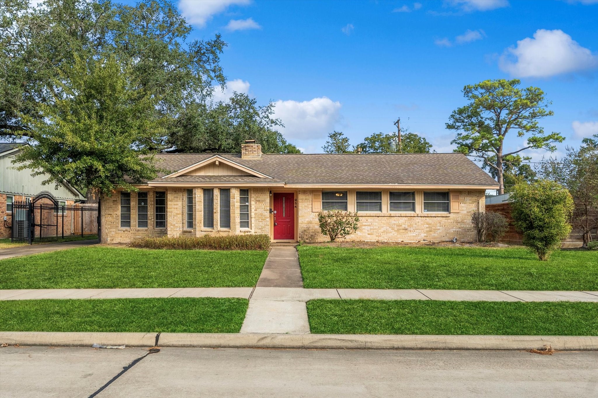 954 Chamboard Lane Houston, TX 77018 - Photo 5 of 36 a front view of a house with a yard