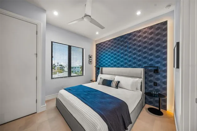 a bedroom with a bed and a television