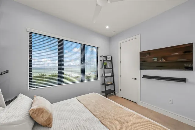a bathroom with a sink vanity mirror and toilet