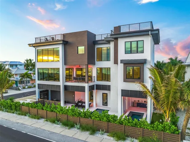 a large kitchen with kitchen island a large window in it