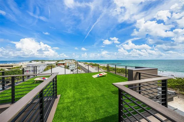 a front view of a residential apartment building with a yard