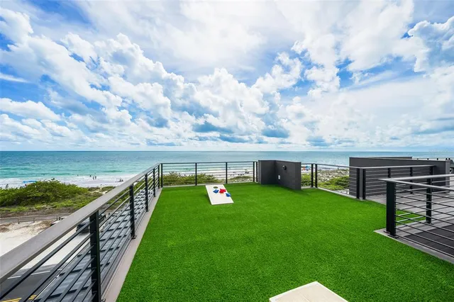 a front view of multi story residential apartment building with yard