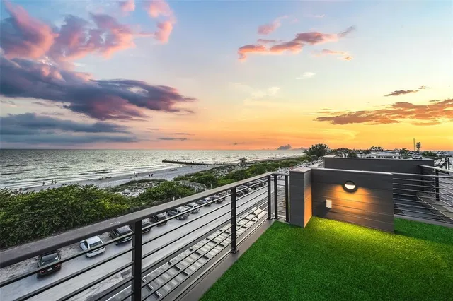 a view of an house with backyard and patio