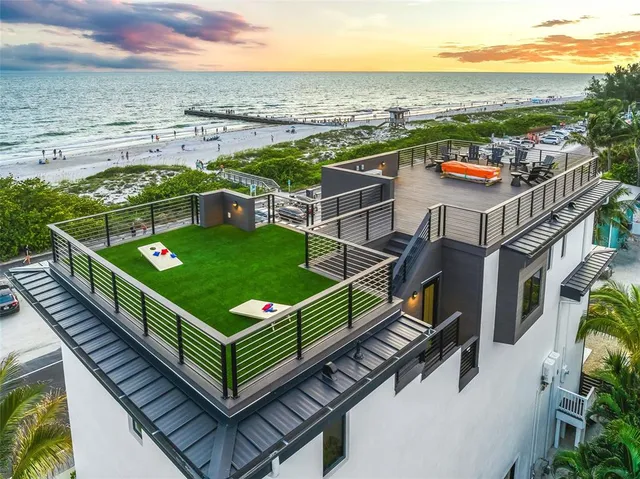 a kitchen with kitchen island sink stove and cabinets