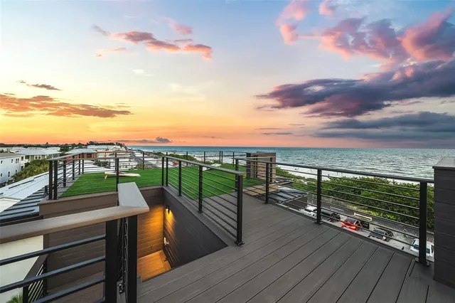 a front view of a house with a road