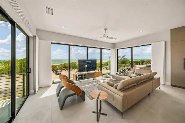 a view of an entryway with wooden floor and door
