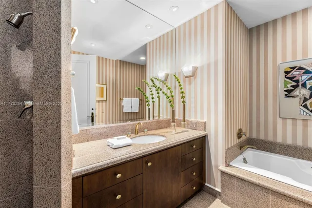 a bathroom with a double vanity sink and a bathtub