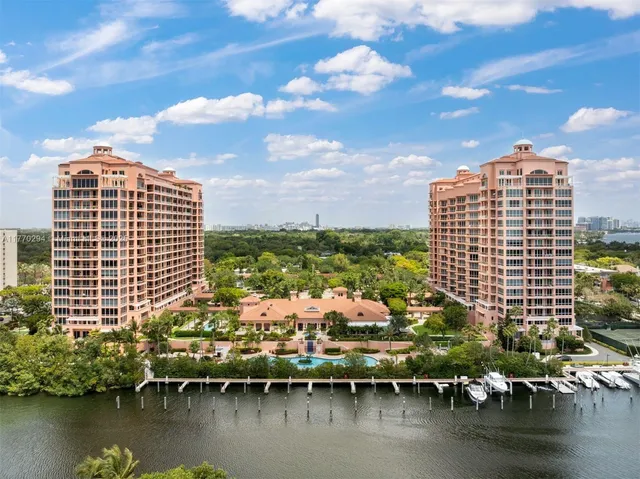 a view of a lake with tall building
