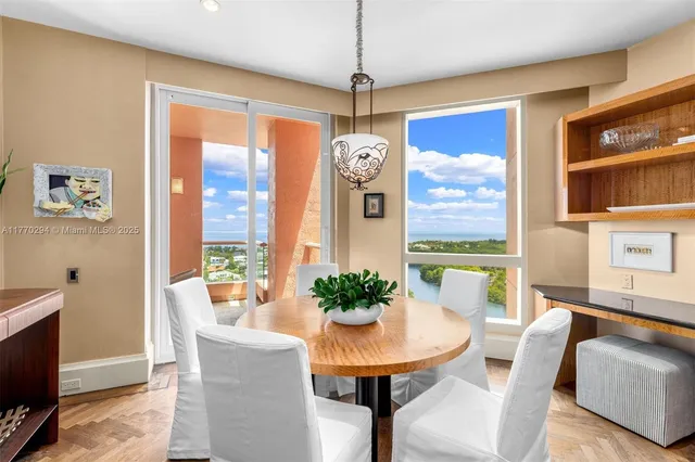 a view of a dining room with furniture window and outside view
