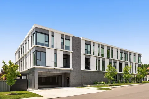 a front view of building with yard