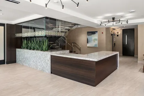 a view of living room kitchen with stainless steel appliances kitchen island a living room and living room view