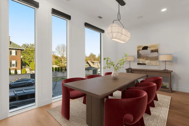 a dining room with furniture and window