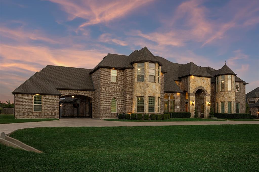 715 Simmons Road Double Oak, TX 75077 - Photo 1 of 40 a front view of a house with a garden