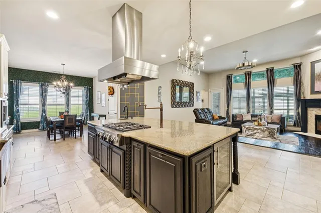 a large kitchen with a table and chairs
