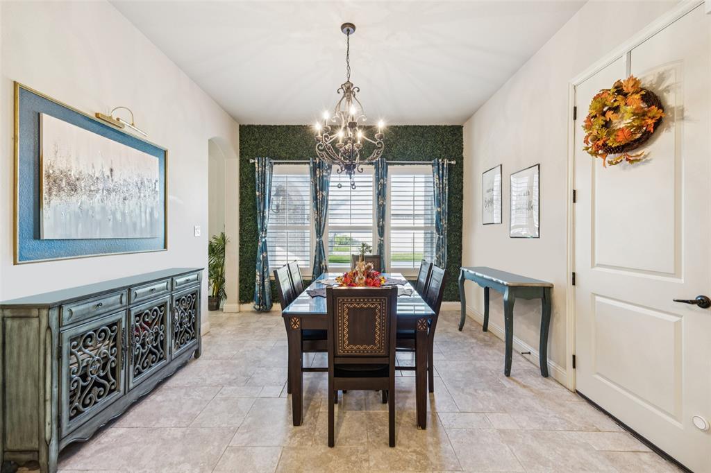 715 Simmons Road Double Oak, TX 75077 - Photo 15 of 40 a view of a dining room with furniture window and outside view