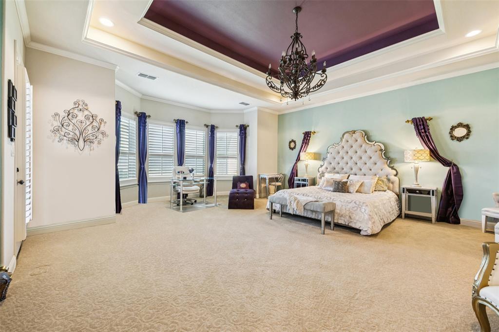 715 Simmons Road Double Oak, TX 75077 - Photo 20 of 40 a living room with furniture and a chandelier