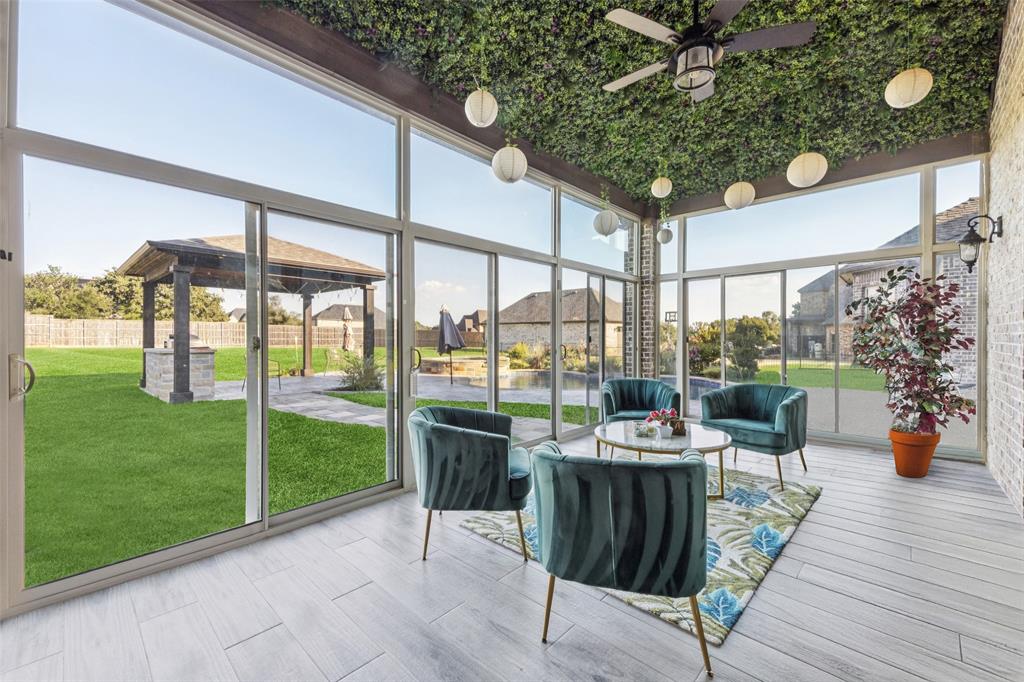 715 Simmons Road Double Oak, TX 75077 - Photo 32 of 40 a view of a patio with couches chairs dining table and chairs