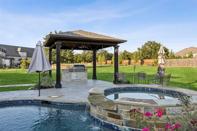 a view of a backyard with a fountain