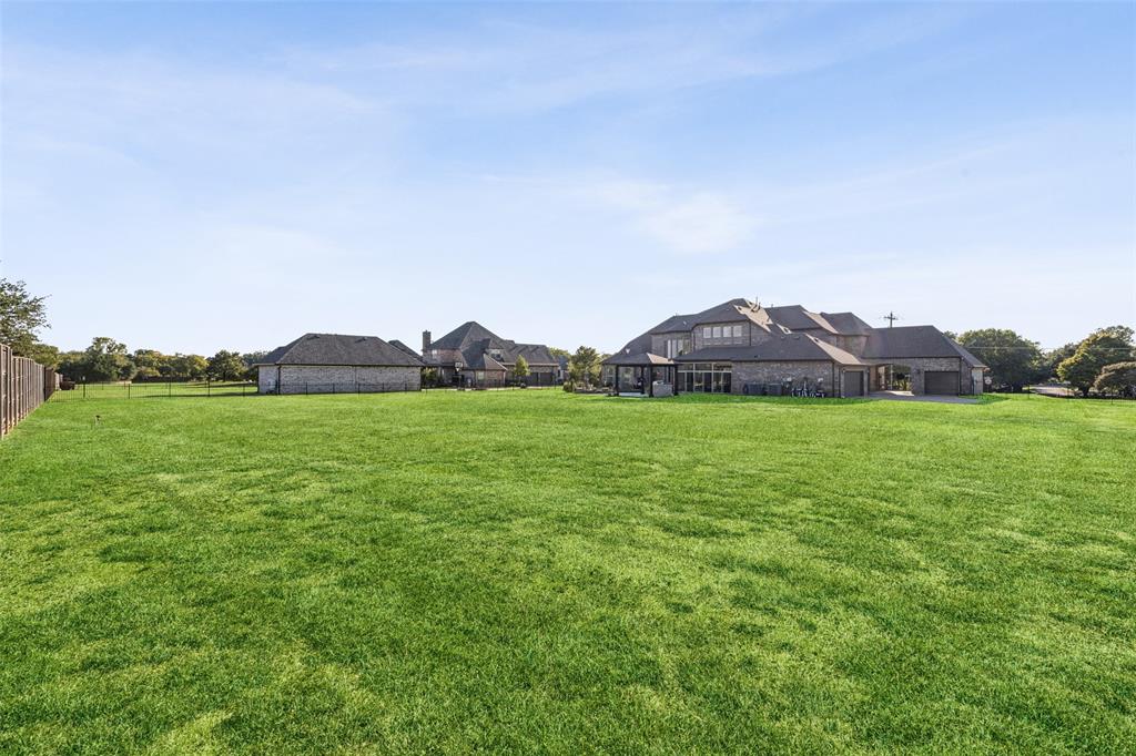 715 Simmons Road Double Oak, TX 75077 - Photo 36 of 40 a view of a field with a tree in front of it