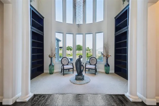 a view of work space with furniture and window
