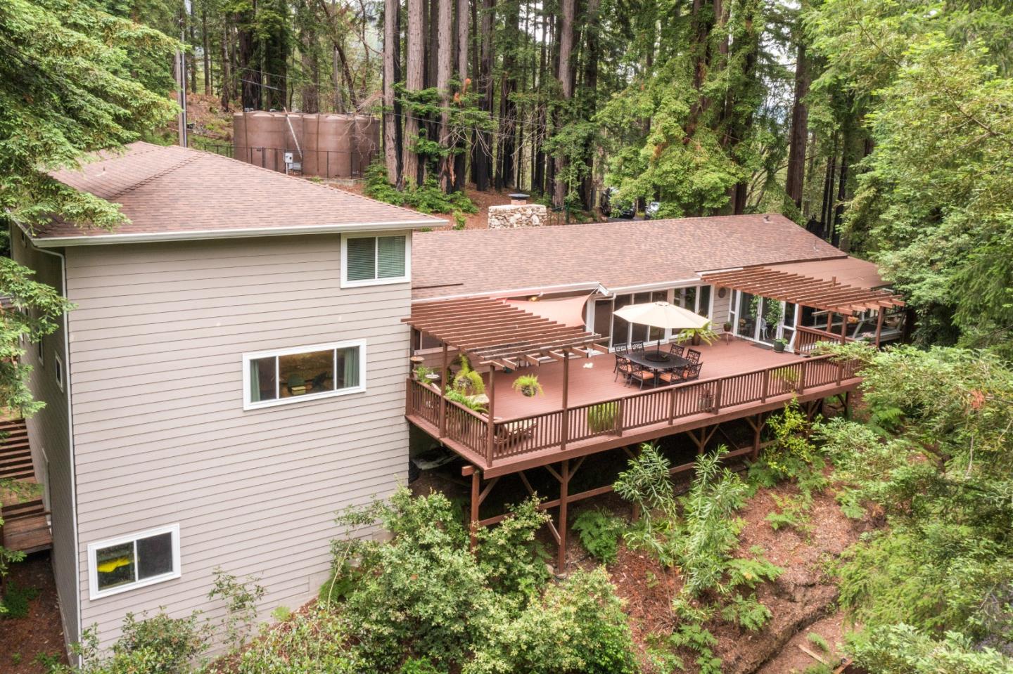 169 Sequoia Grove Ben Lomond, CA 95005 - Photo 12 of 42 a aerial view of a house with balcony and trees al around