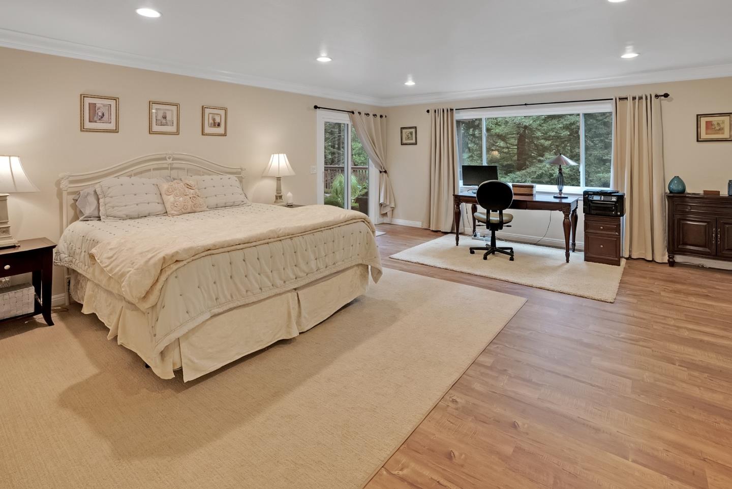 169 Sequoia Grove Ben Lomond, CA 95005 - Photo 21 of 42 a spacious bedroom with a bed and glass table