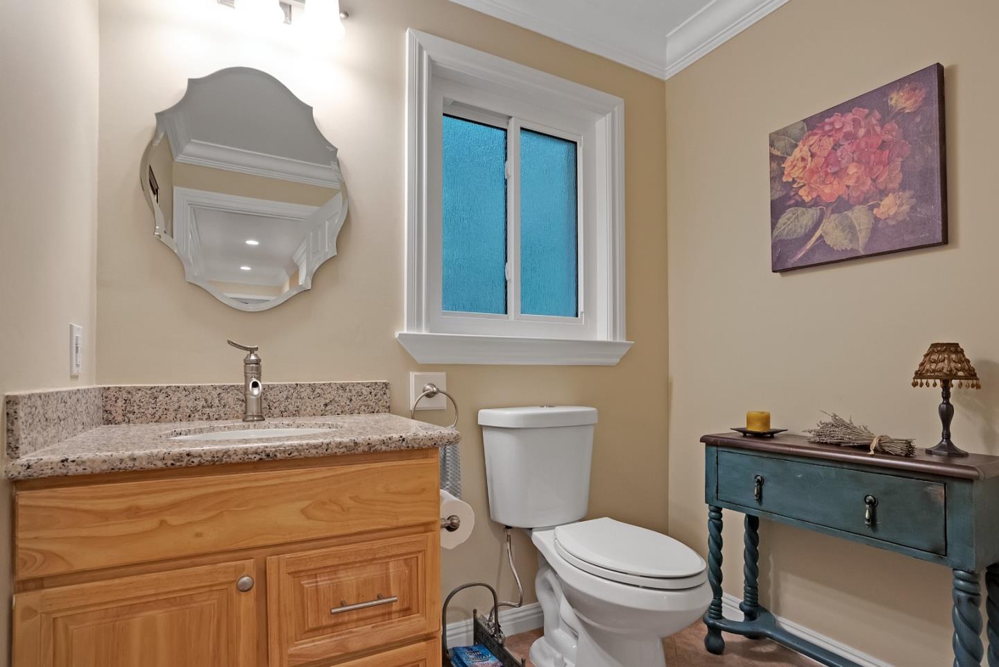 169 Sequoia Grove Ben Lomond, CA 95005 - Photo 24 of 42 a bathroom with a toilet a sink and a mirror