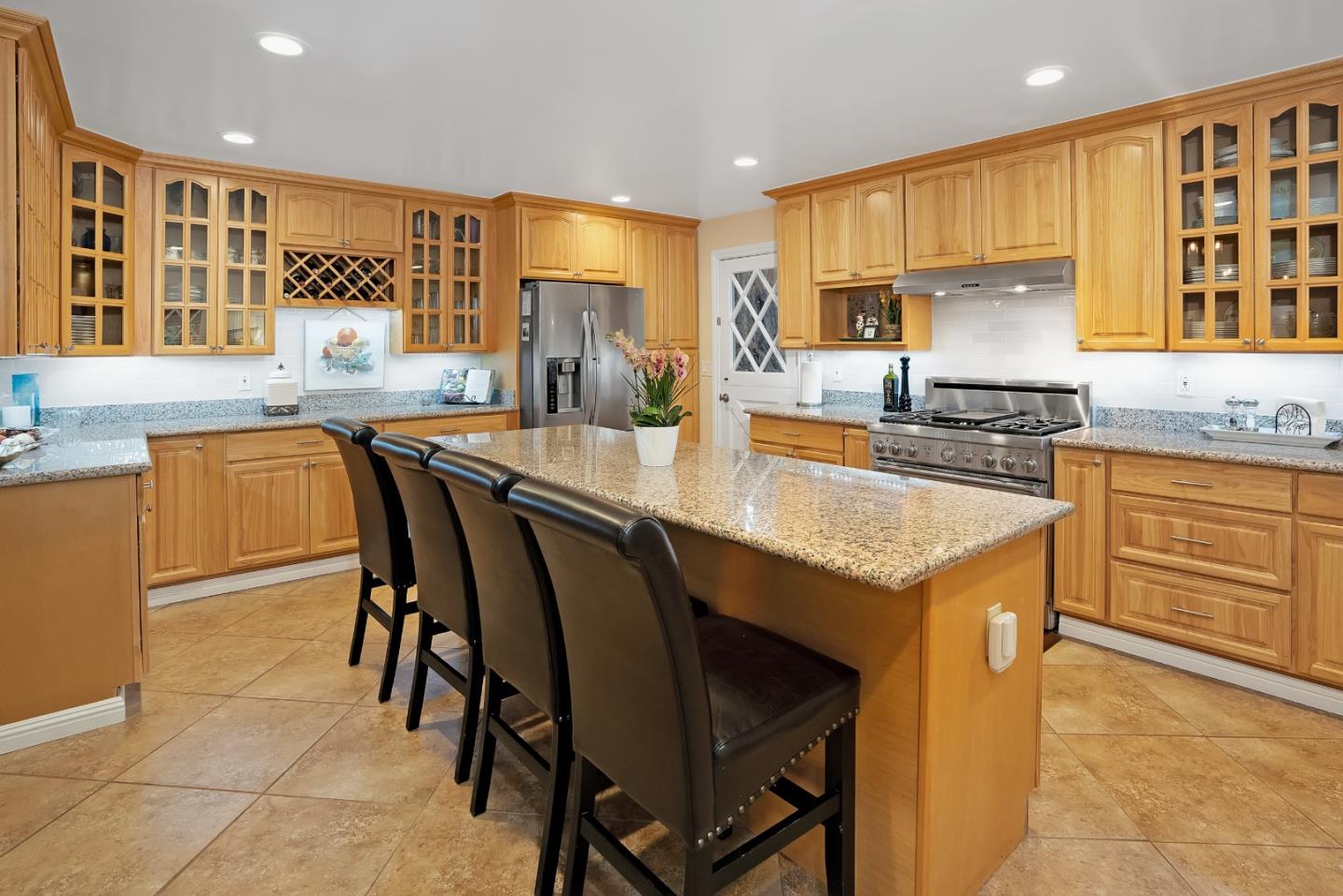 169 Sequoia Grove Ben Lomond, CA 95005 - Photo 29 of 42 a kitchen with stainless steel appliances granite countertop table chairs sink refrigerator and cabinets