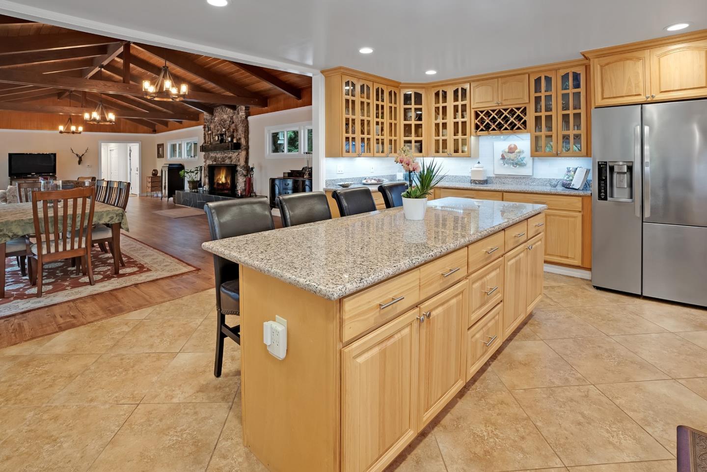169 Sequoia Grove Ben Lomond, CA 95005 - Photo 31 of 42 a kitchen with stainless steel appliances granite countertop a table chairs and a refrigerator