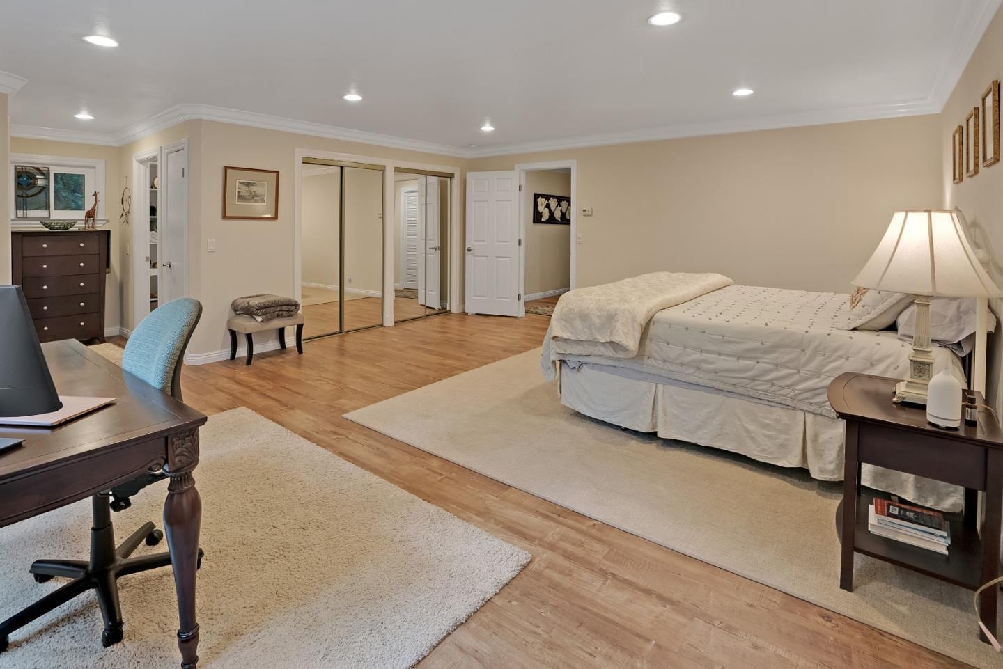 169 Sequoia Grove Ben Lomond, CA 95005 - Photo 40 of 42 a spacious bedroom with a bed a table and chair