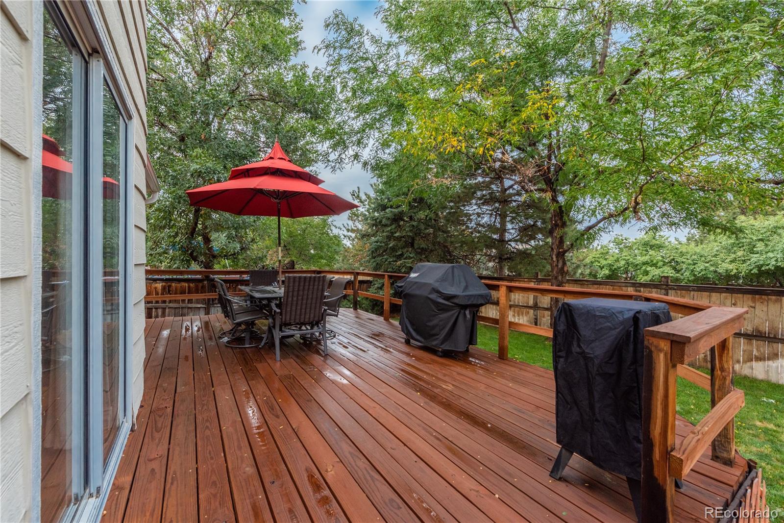 9548 South Castle Ridge Circle Highlands Ranch, CO 80129 - Photo 27 of 31 a view of balcony with outdoor seating and wooden floor