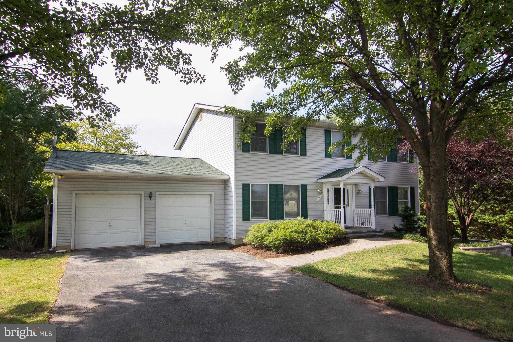 1766 Bloom Road Westminster, MD 21157 - Photo 1 of 29 a front view of a house with a garden