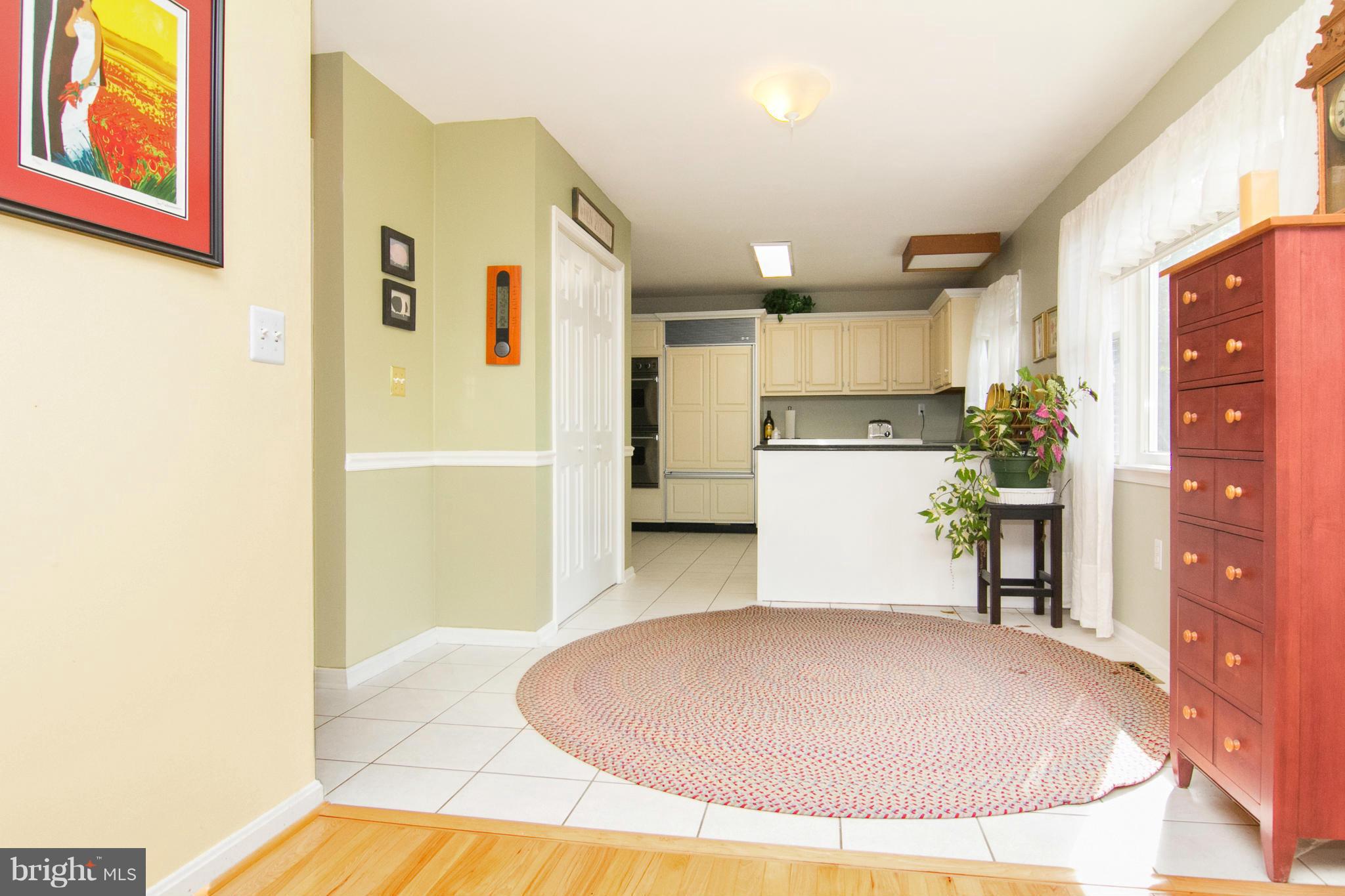 1766 Bloom Road Westminster, MD 21157 - Photo 12 of 29 a view of a kitchen with a refrigerator and a fireplace