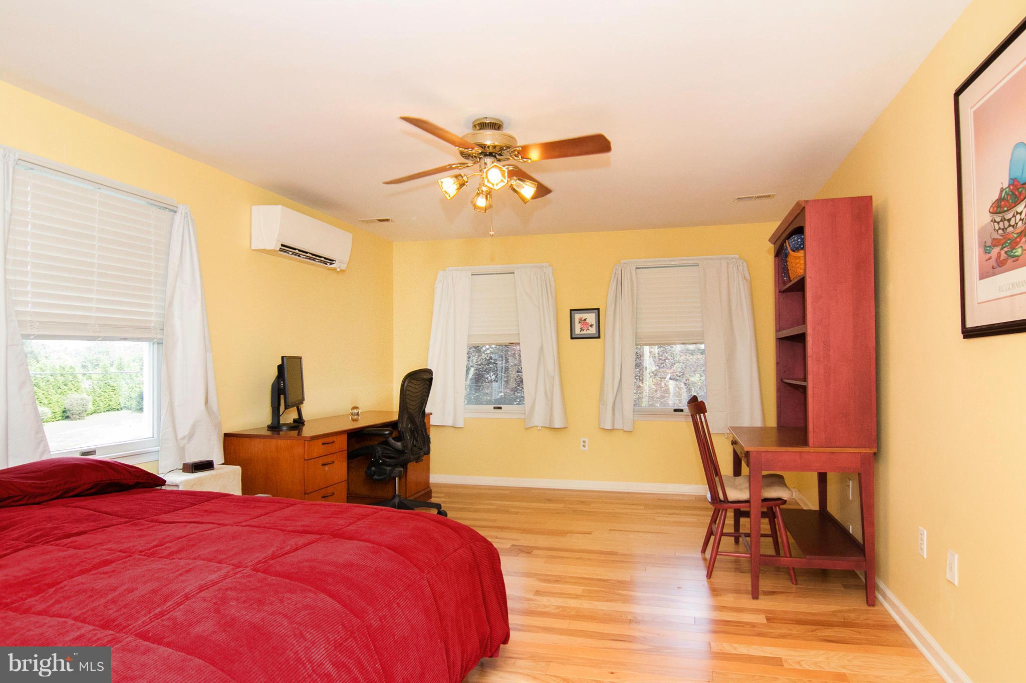 1766 Bloom Road Westminster, MD 21157 - Photo 14 of 29 a bedroom with a bed and wooden floor